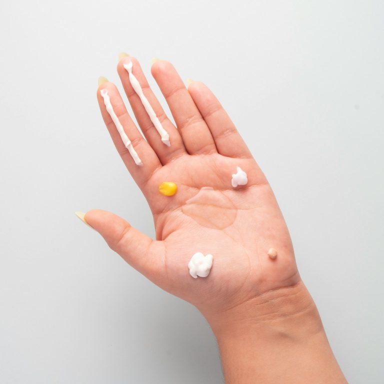 a hand with a pill